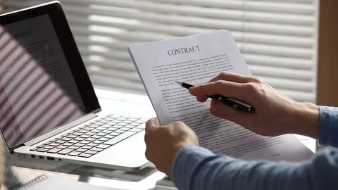 Reading contract agreement printed document, corporate business deal Stock Footage 140033029