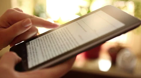 Reading on digital tablet HD 1080i Stock Footage 35737550