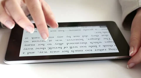 Reading on digital tablet HD Dolly 1080i Stock Footage 34360633
