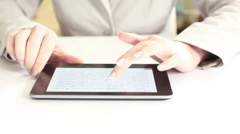 Reading on digital tablet HD Dolly 1080i Stock Footage 34361106