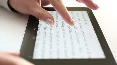 Reading on digital tablet HD Dolly 1080i Stock Footage 34361149