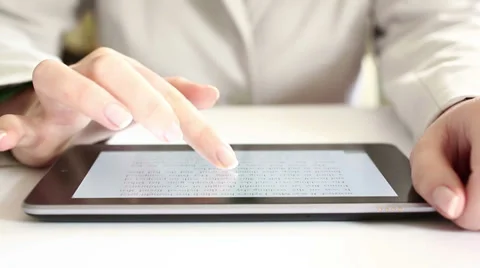 Reading on digital tablet HD Dolly 1080i Stock Footage 34361168