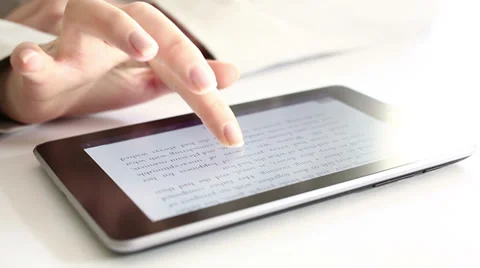 Reading on digital tablet HD Dolly 1080i Stock Footage 34361427