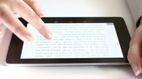 Reading on digital tablet HD Stock Footage 34360638