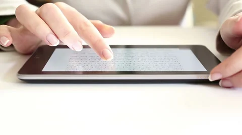 Reading on digital tablet HD Stock Footage 34361156