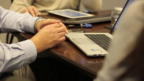 Reading document on laptop Stock Footage 77048212