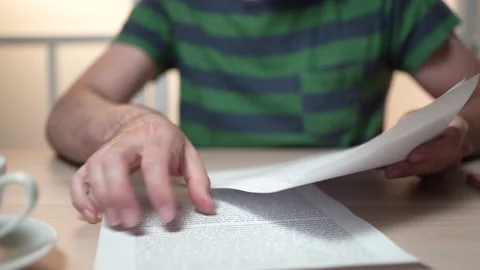 Reading Documents and Text at a Desk Stock Footage 158119143