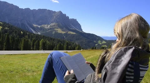 Reading in the Dolomites Alps Stock Footage 42117484