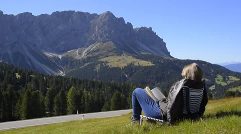 Reading in the Dolomites Alps Stock Footage 42121427