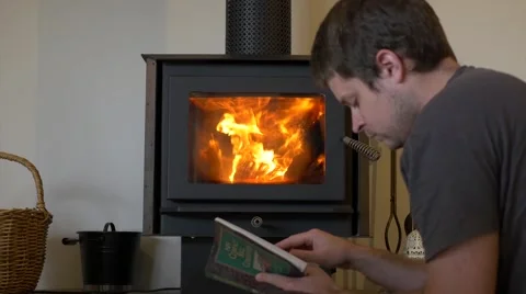 Reading By Fire Place - dolly shot Stock Footage 40300896