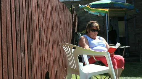 Reading in garden Video stock 862936