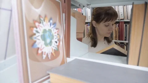 Reading girl in library Stock Footage 71103940