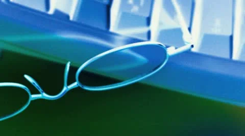 Reading glasses and keyboard Stock Footage 20545582
