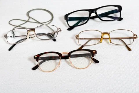 Reading glasses on the white table Stock Photos