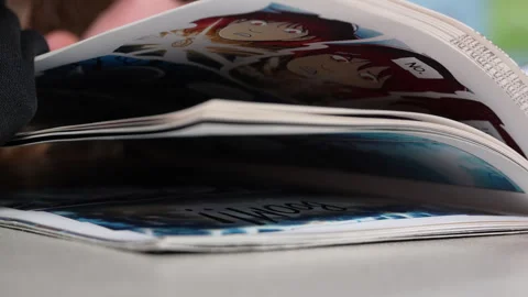 Reading A Graphic Novel Stock-Footage 270244484