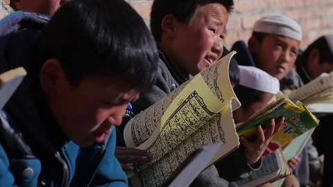 Reading the koran China Video stock 77176344