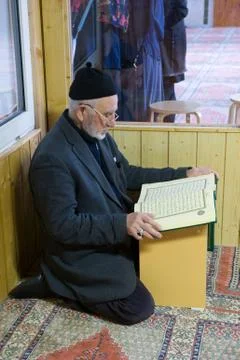 Reading the koran Stock Photos