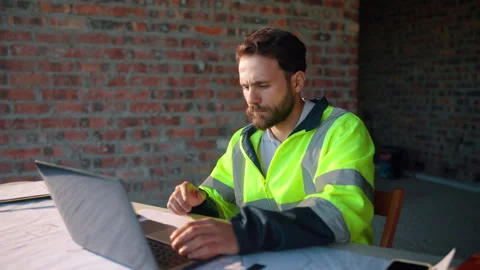 Reading, laptop or man with calculator at construction site, typing email or Stock Footage 336205728