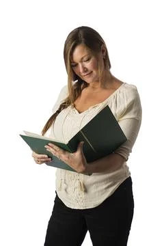 Reading a large book Stock-Fotos