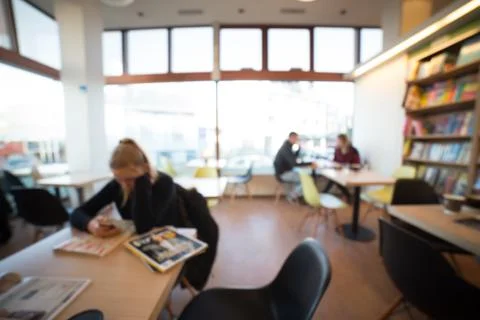 Reading in library Stock Photos