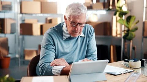 Reading, man and tablet in small business for logistics, monitor live shipping Stock Photos