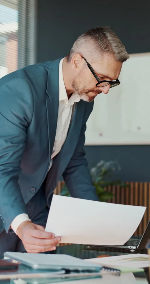 Reading, man or laptop with documents in office for data analysis, policy update Stock Footage 332970960
