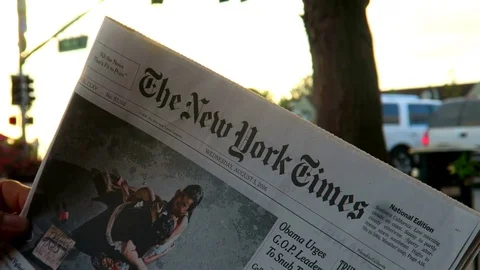 Reading the news in the city Stock Footage 75654834