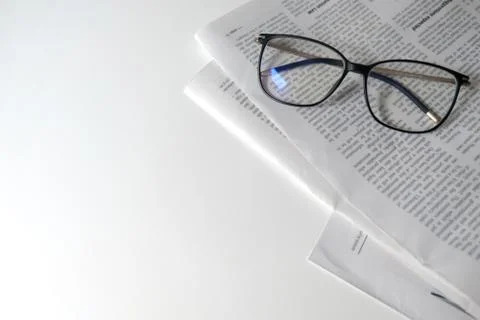 Reading newspaper in isolation. Learning place for homeschooling or workplace Stock Photos
