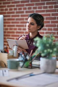Reading, notebook and woman with computer in creative agency, planning launch an Stock Photos