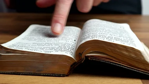 Reading An OLd Book And Using The Finger As A Reading Guide 스톡 동영상 132734846