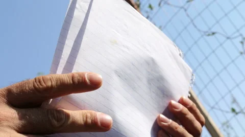 Reading from a paper Stock Footage 43395539