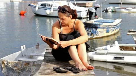 Reading in the port Stock Footage 12564703