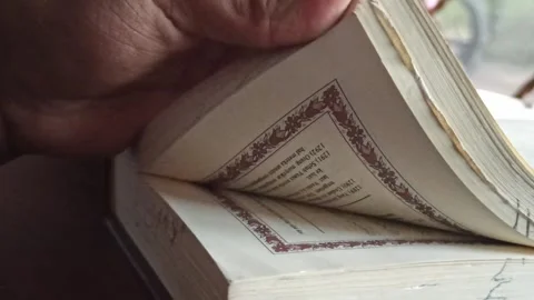 Reading the Quran with Translation Stock Footage 255085619