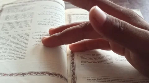 Reading the Quran with Translation Stock-Footage 255085855