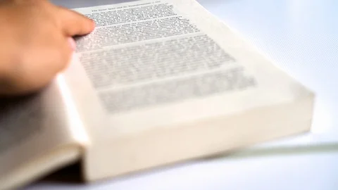 Reading religious book and pointing at text Stock Footage 121198165