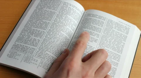 Reading a religious book with glasses Stock Footage 49429460