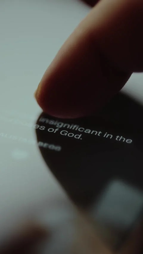 Reading a religious message on a Christian app Stock Footage 327523318