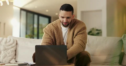 Reading, remote work and man with laptop in home, planning, website testing or Stock Footage 335264851