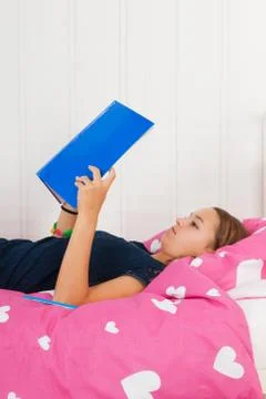 Reading a school book Foto stock