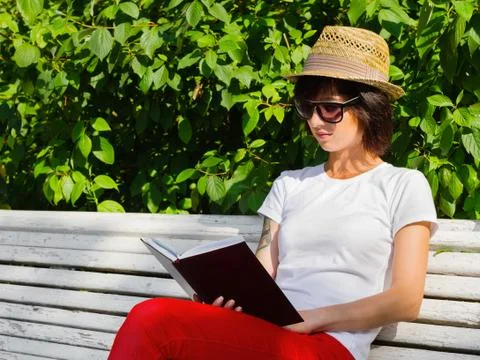 Reading in the summer garden Stock Photos