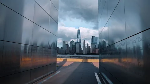 Reading the terrorist attack victims' names on the metal walls of Empty Sky Stock Footage 318225195