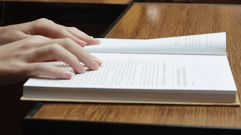 Reading the text in the book Stock Footage 93020178