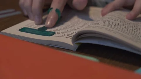 Reading tools for dyslexia. Child reading book using finger focus highlighter Stock Footage 228682730