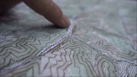 READING TOPOGRAPHIC MAP SLOW MOTION Stock Footage 84230126