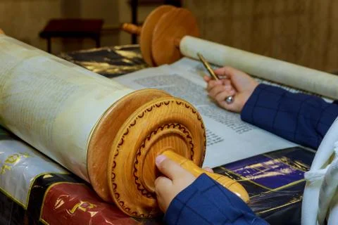 Reading a Torah scroll during a bar mitzvah ceremony . Stock Photos