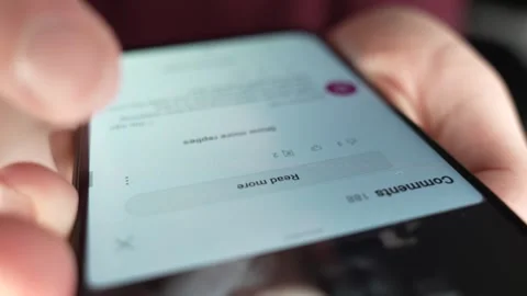 Reading User Comments Online On a Smartphone Screen Stock Footage 270818307