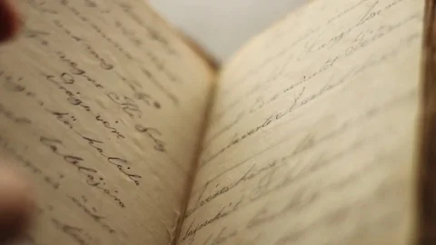 Reading a vintage book. Video stock 75944714