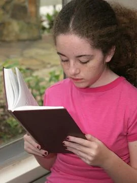 Reading By Window Light Stock Photos