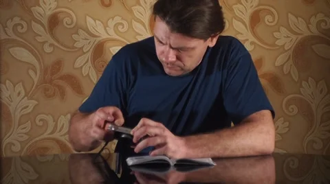 Reads the instructions and looking camera Video stock 35720309