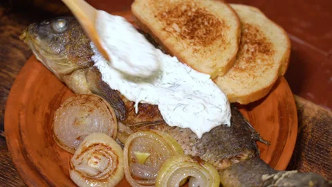 Ready carp on a plate with garnish Stock Footage 251875795